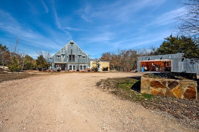 exterior space featuring dirt driveway