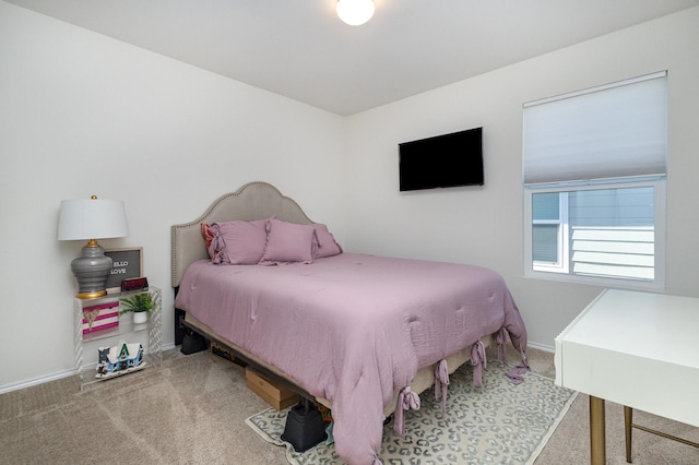 carpeted bedroom with baseboards