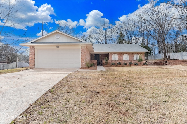 single story home with brick siding, an attached garage, a front lawn, fence, and driveway