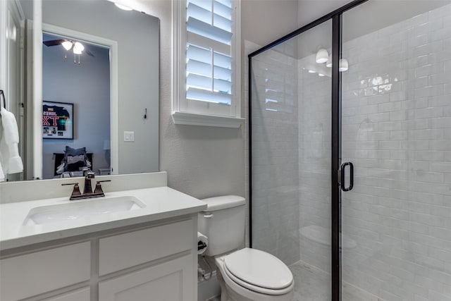 full bathroom with ensuite bathroom, a textured wall, toilet, vanity, and a stall shower