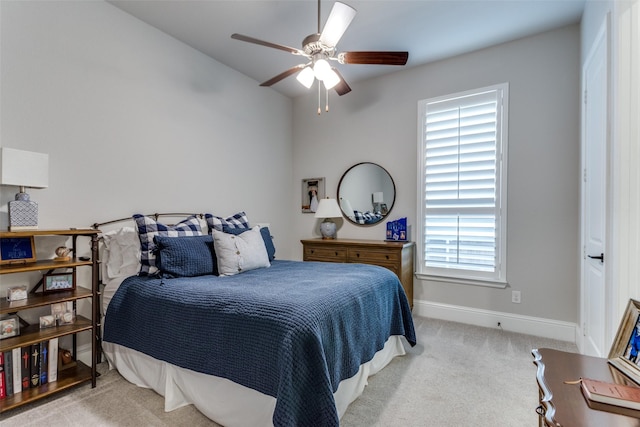 bedroom with carpet floors, ceiling fan, and baseboards