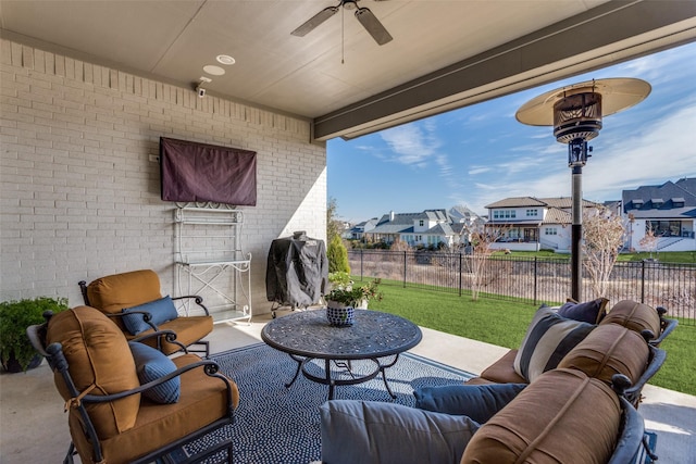 view of patio / terrace with a residential view, fence, and an outdoor living space