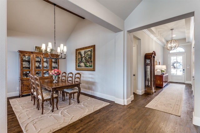 dining room with baseboards, a chandelier, vaulted ceiling, and dark wood-type flooring