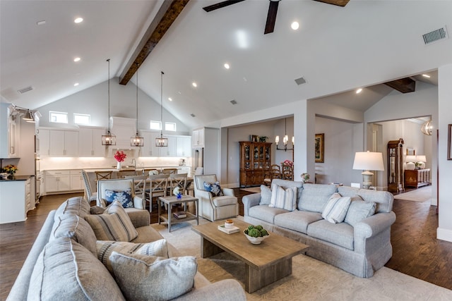 living area with high vaulted ceiling, dark wood-style flooring, visible vents, and beam ceiling