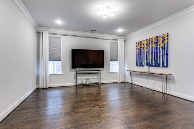 unfurnished living room with a wealth of natural light, crown molding, and wood finished floors