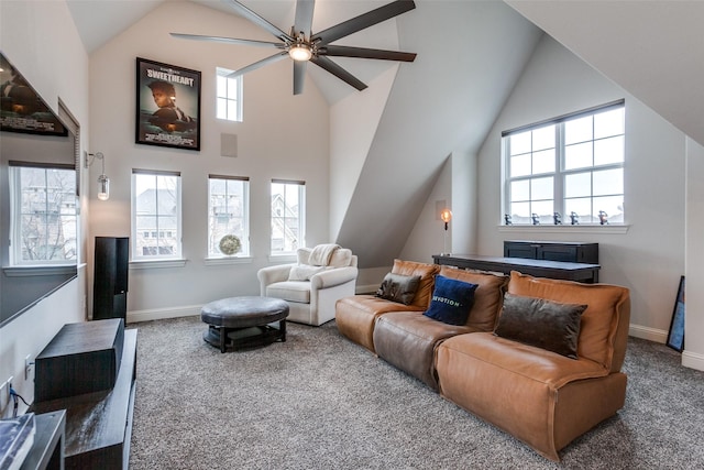 living area featuring a healthy amount of sunlight, baseboards, and carpet flooring