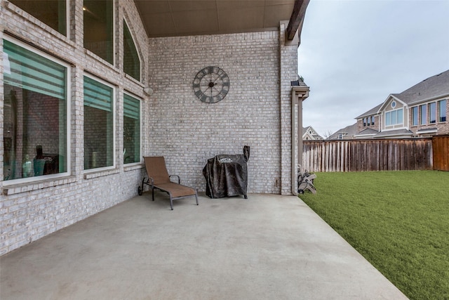 view of patio / terrace featuring fence