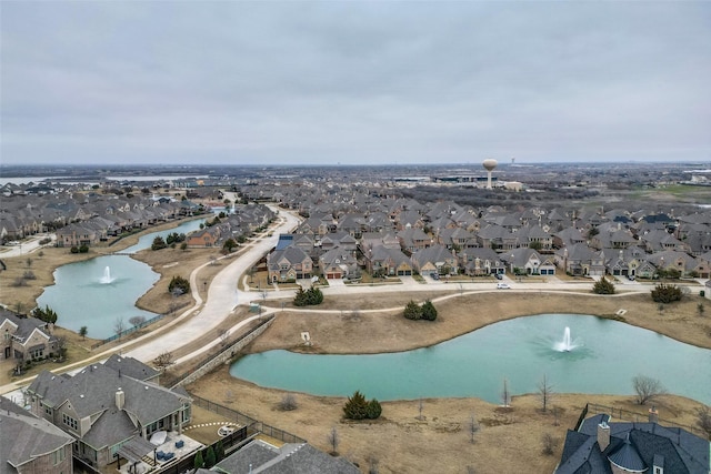 bird's eye view with a water view and a residential view