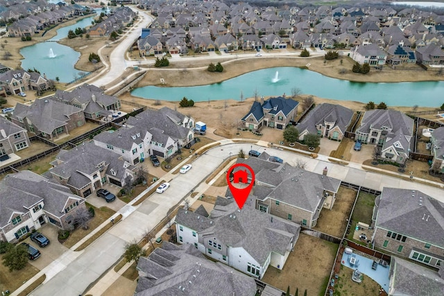 aerial view with a water view and a residential view