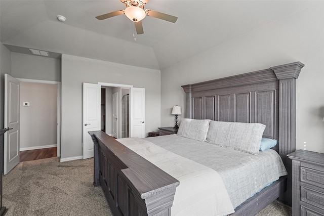 bedroom with lofted ceiling, ceiling fan, carpet flooring, visible vents, and baseboards