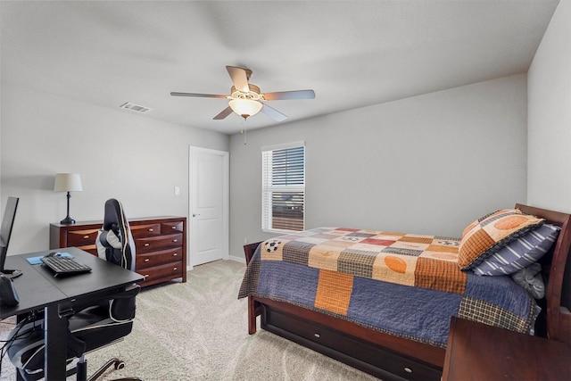 bedroom featuring ceiling fan, visible vents, and light colored carpet