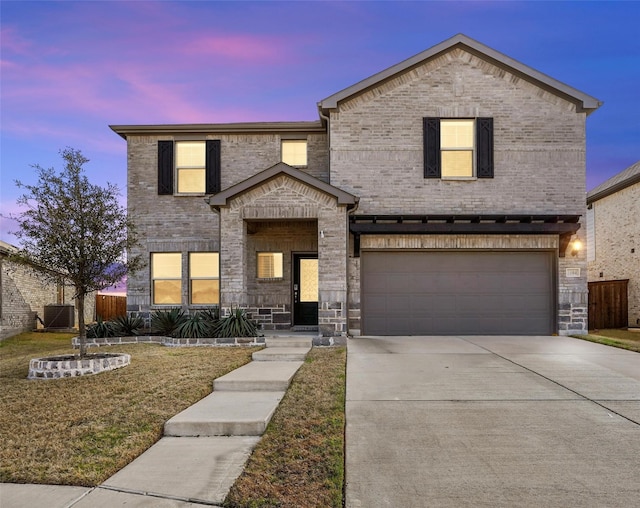 traditional home featuring central AC unit, concrete driveway, an attached garage, fence, and brick siding