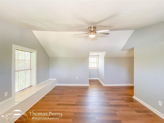 bonus room featuring ceiling fan, wood finished floors, lofted ceiling, and baseboards