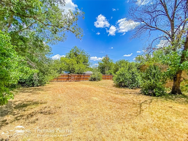 view of yard with fence