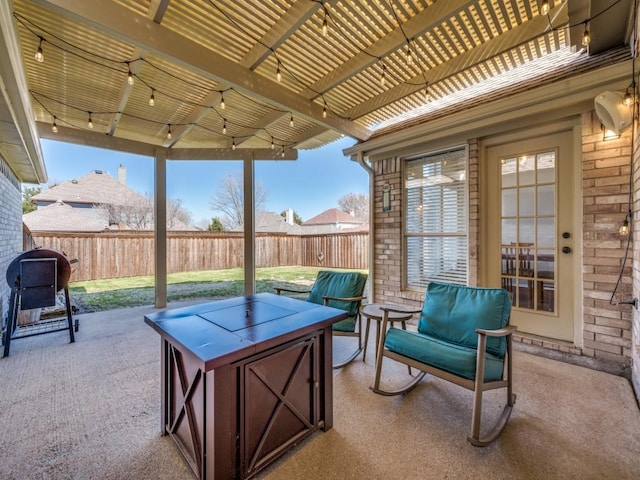 view of patio / terrace with grilling area and fence