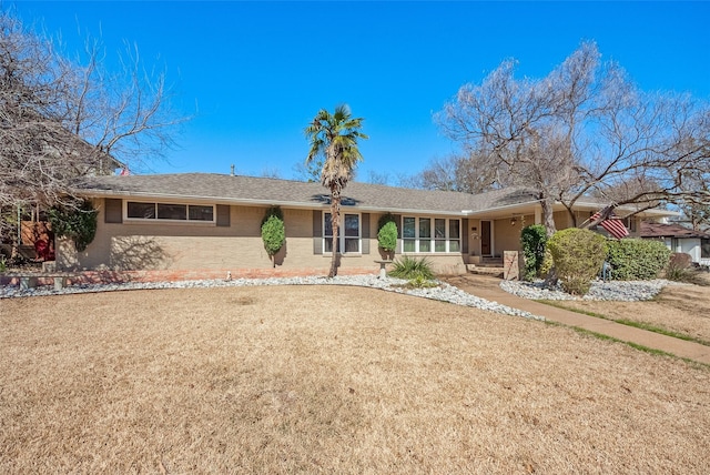 single story home with a front yard