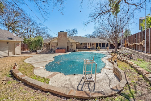 view of pool featuring a patio, a fenced backyard, a jacuzzi, and a covered pool