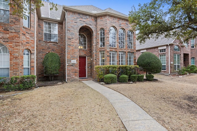 view of front facade featuring brick siding