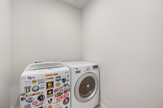 washroom with washer and dryer and laundry area