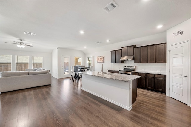 kitchen featuring dark brown cabinetry, dark wood-style flooring, stainless steel range with electric cooktop, under cabinet range hood, and a sink