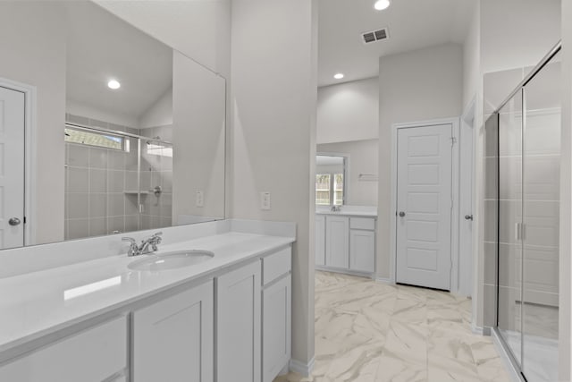 full bathroom featuring vanity, visible vents, marble finish floor, a shower stall, and plenty of natural light