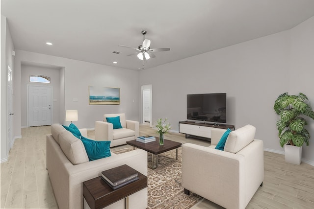 living area with a ceiling fan, recessed lighting, baseboards, and light wood finished floors