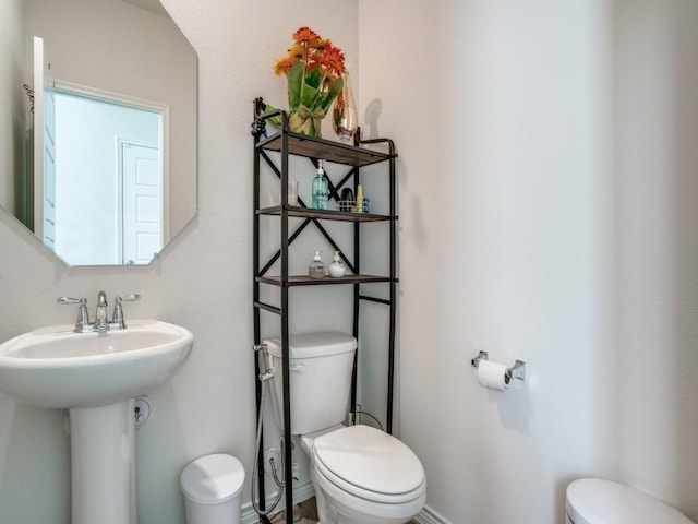 bathroom with a sink and toilet