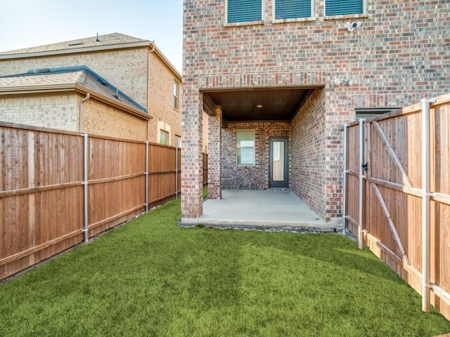 view of yard featuring a patio and fence