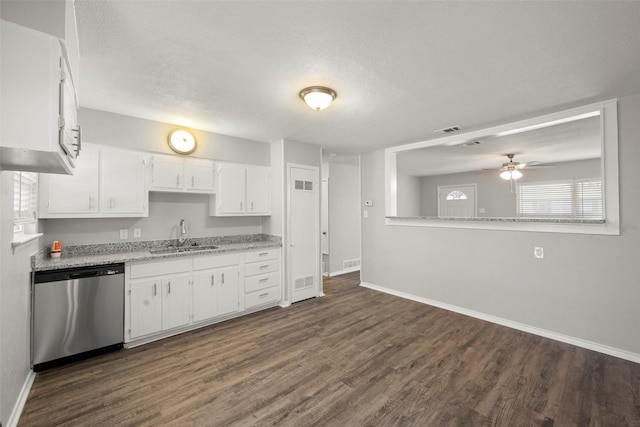 kitchen featuring dark wood-type flooring, a sink, visible vents, white cabinets, and dishwasher