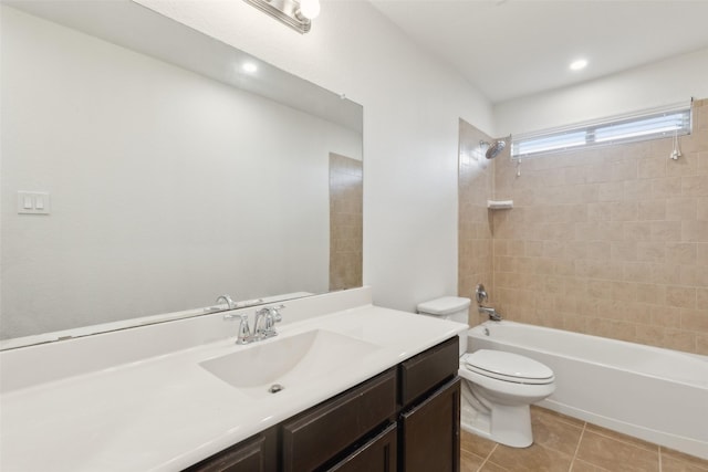 full bath featuring washtub / shower combination, vanity, tile patterned flooring, and toilet