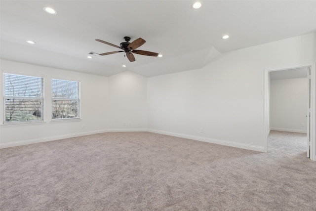 carpeted empty room featuring baseboards, vaulted ceiling, a ceiling fan, and recessed lighting