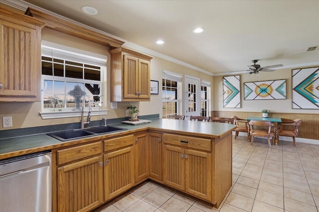 kitchen featuring dishwasher, ceiling fan, a peninsula, crown molding, and a sink