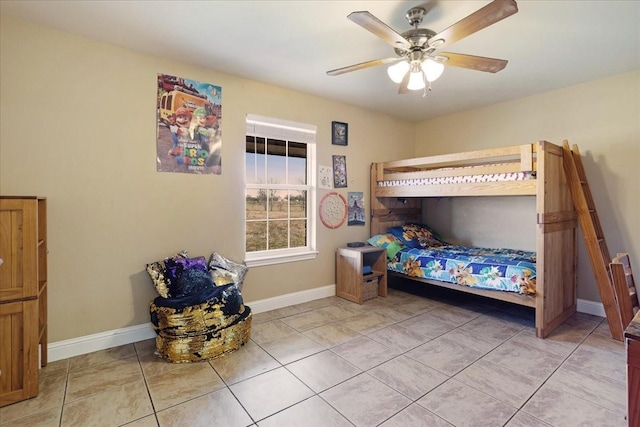 bedroom with baseboards, a ceiling fan, and light tile patterned flooring