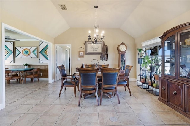 dining space featuring vaulted ceiling, light tile patterned floors, visible vents, and an inviting chandelier