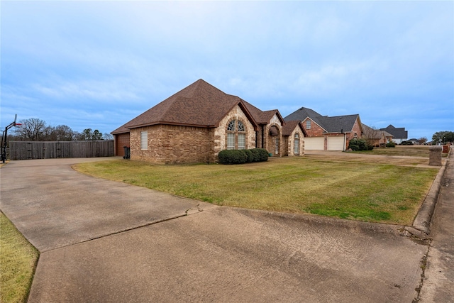 3630 Darnell Dr, Paris, TX 75462 - french country home with brick siding, a front lawn, concrete driveway, and a shingled roof