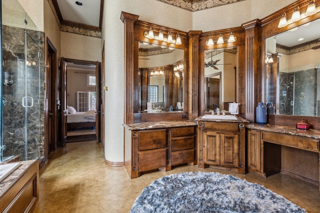 full bathroom featuring vanity, ceiling fan, a shower stall, ensuite bathroom, and crown molding