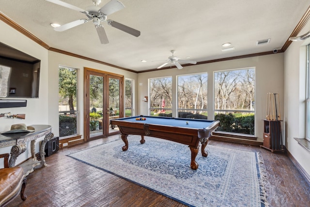 rec room featuring a wealth of natural light, visible vents, crown molding, and wood finished floors