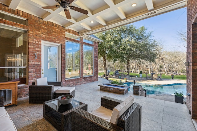 view of patio with an outdoor pool, a fire pit, and ceiling fan