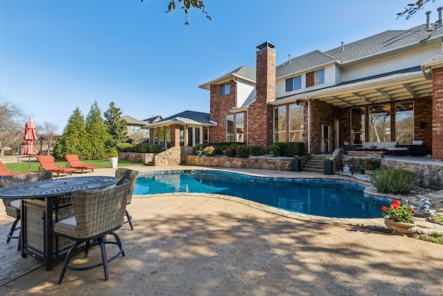 pool with a patio area