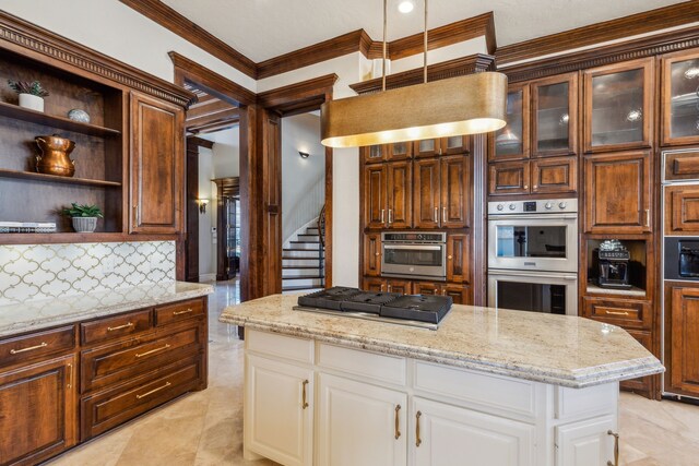 living area featuring baseboards, visible vents, a premium fireplace, recessed lighting, and crown molding