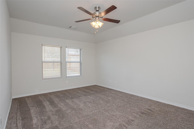 unfurnished room with a ceiling fan, carpet, visible vents, and baseboards