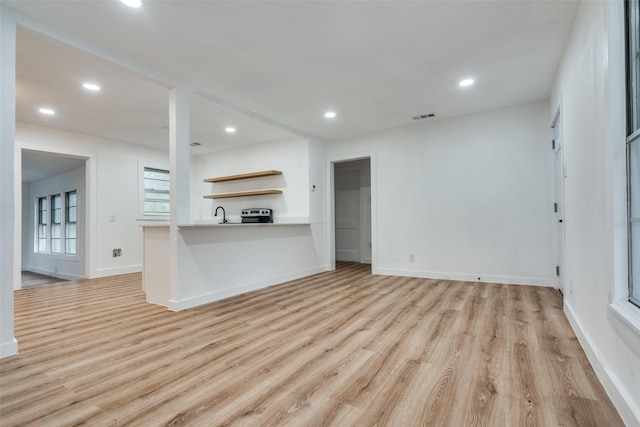 kitchen featuring recessed lighting, visible vents, baseboards, light wood-style floors, and open shelves