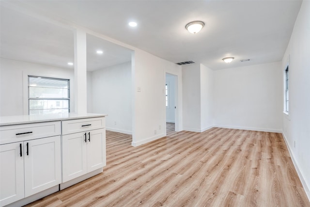 unfurnished room featuring recessed lighting, baseboards, visible vents, and light wood finished floors