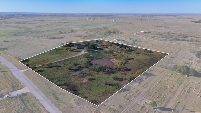 birds eye view of property with a rural view