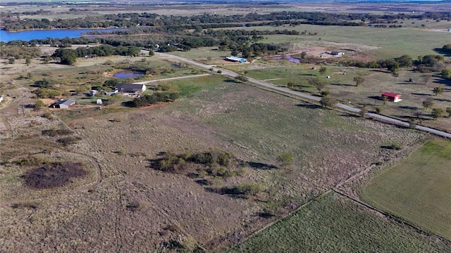 aerial view with a rural view and a water view