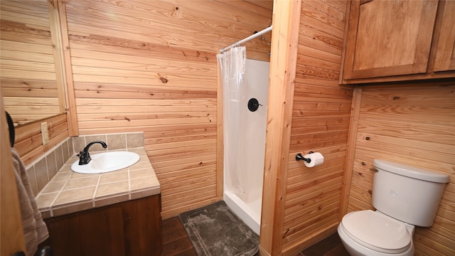 full bathroom featuring wood walls, vanity, toilet, and a shower with curtain