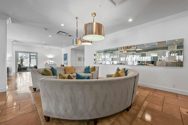 living room featuring baseboards, crown molding, and recessed lighting