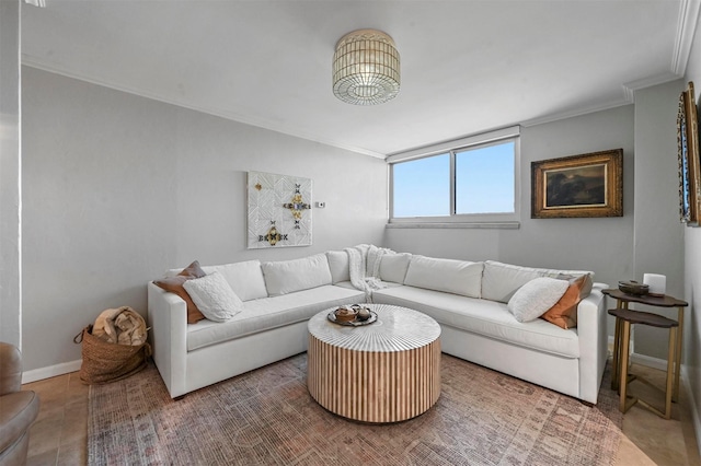 living area with baseboards and crown molding