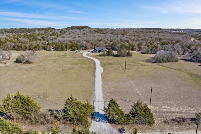 birds eye view of property with a rural view