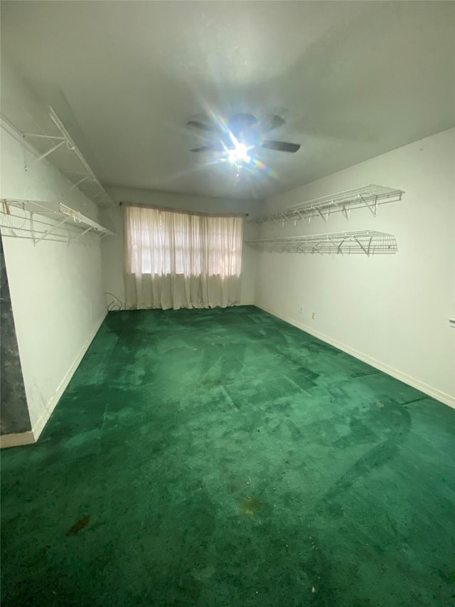 carpeted empty room with baseboards